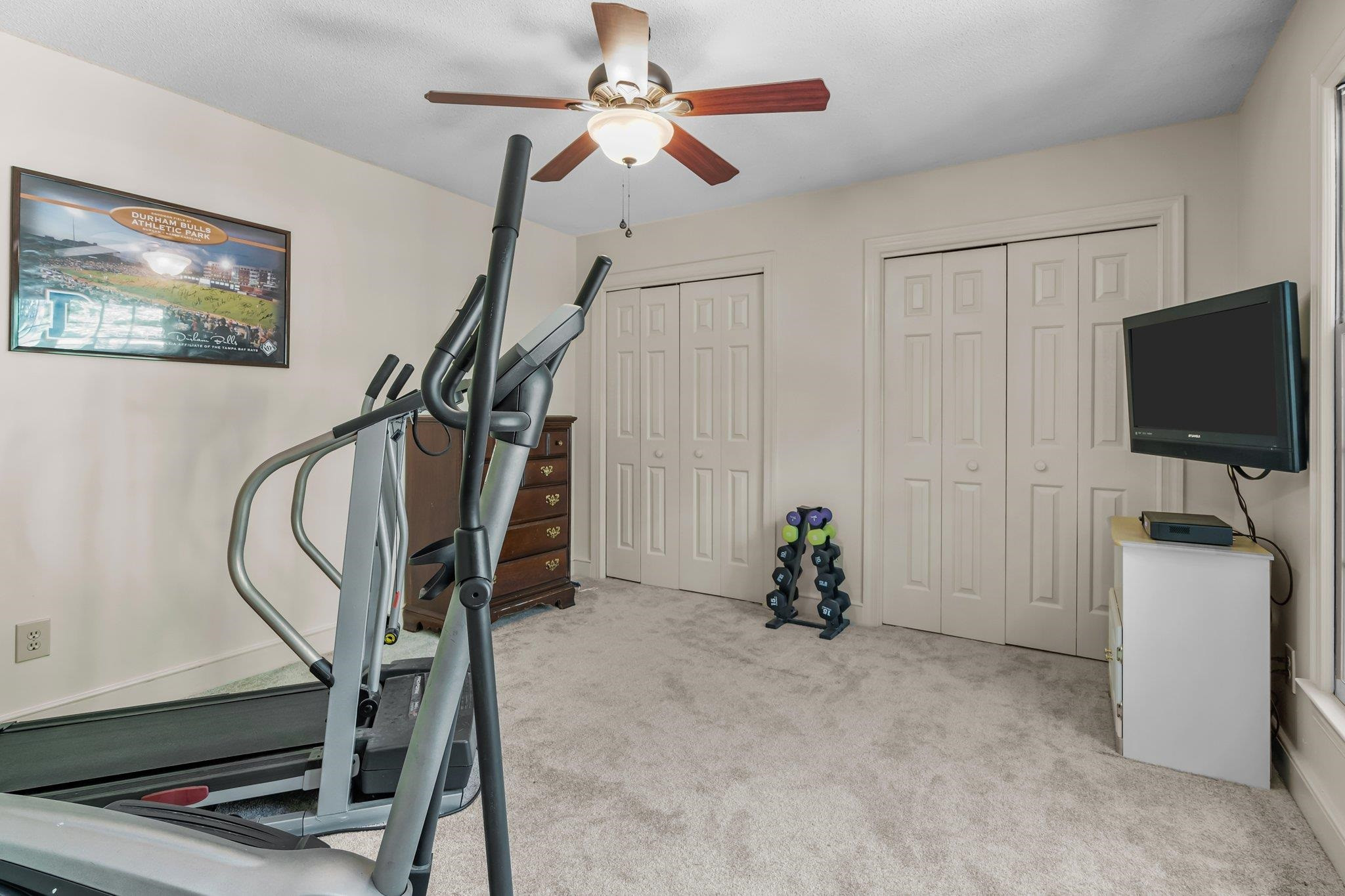 4918 Highgate Drive Durham, NC 27713 - Photo 38 of 44 a living room with furniture and a flat screen tv