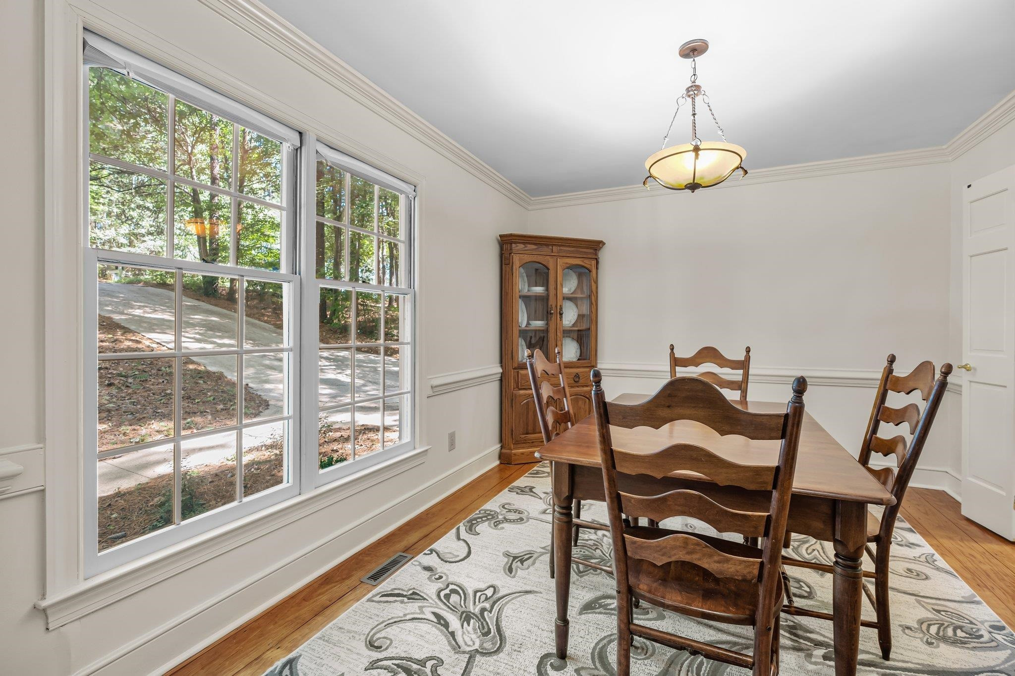 4918 Highgate Drive Durham, NC 27713 - Photo 4 of 44 a view of a dining room with furniture wooden floor and chandelier
