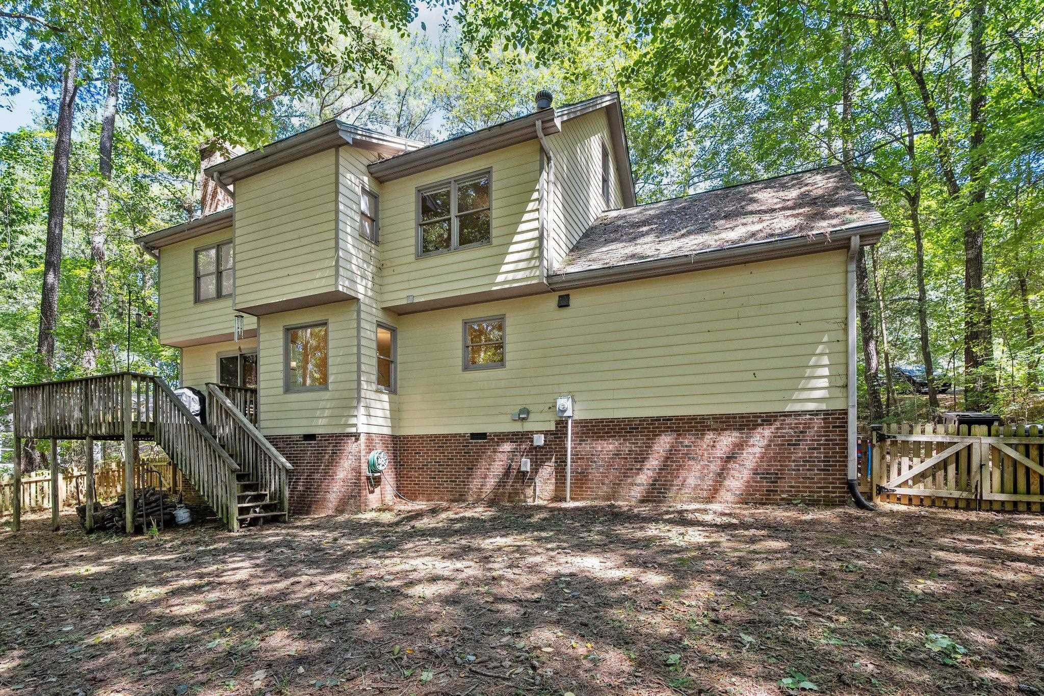 4918 Highgate Drive Durham, NC 27713 - Photo 41 of 44 a view of a house with a yard