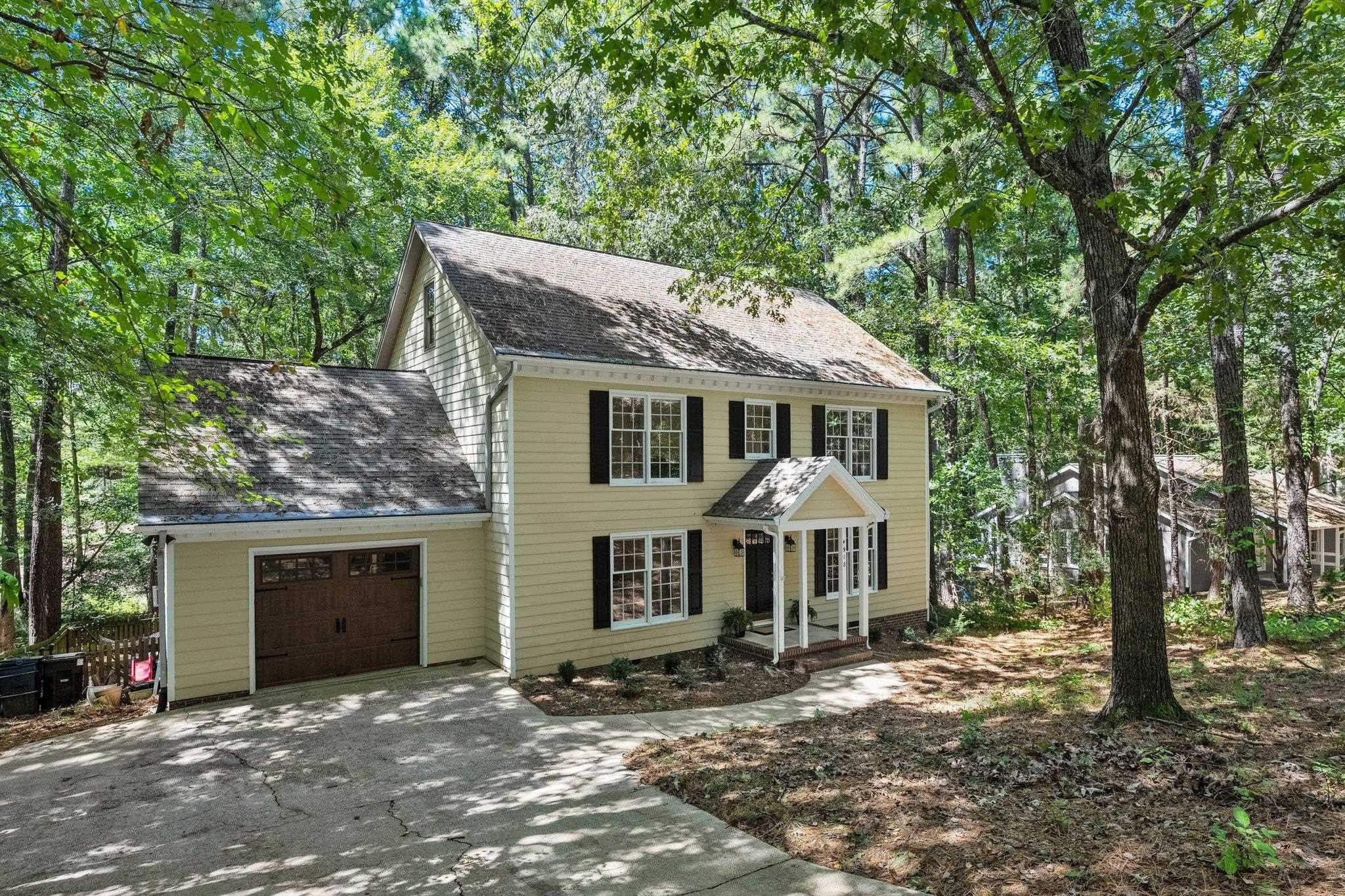 4918 Highgate Drive Durham, NC 27713 - Photo 43 of 44 a front view of a house with a garden