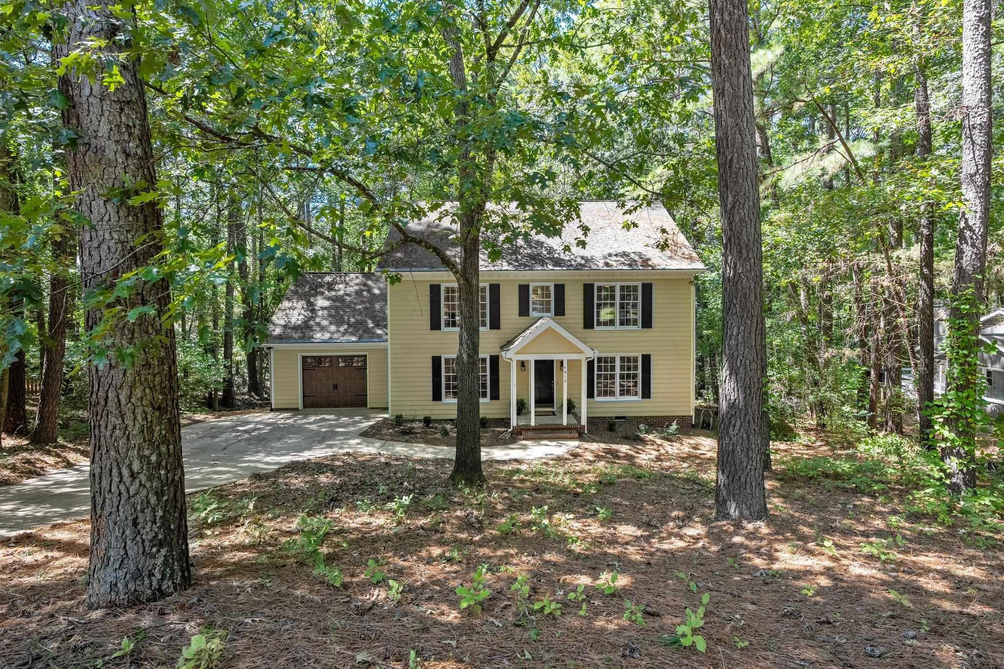 4918 Highgate Drive Durham, NC 27713 - Photo 44 of 44 a front view of a house with a yard