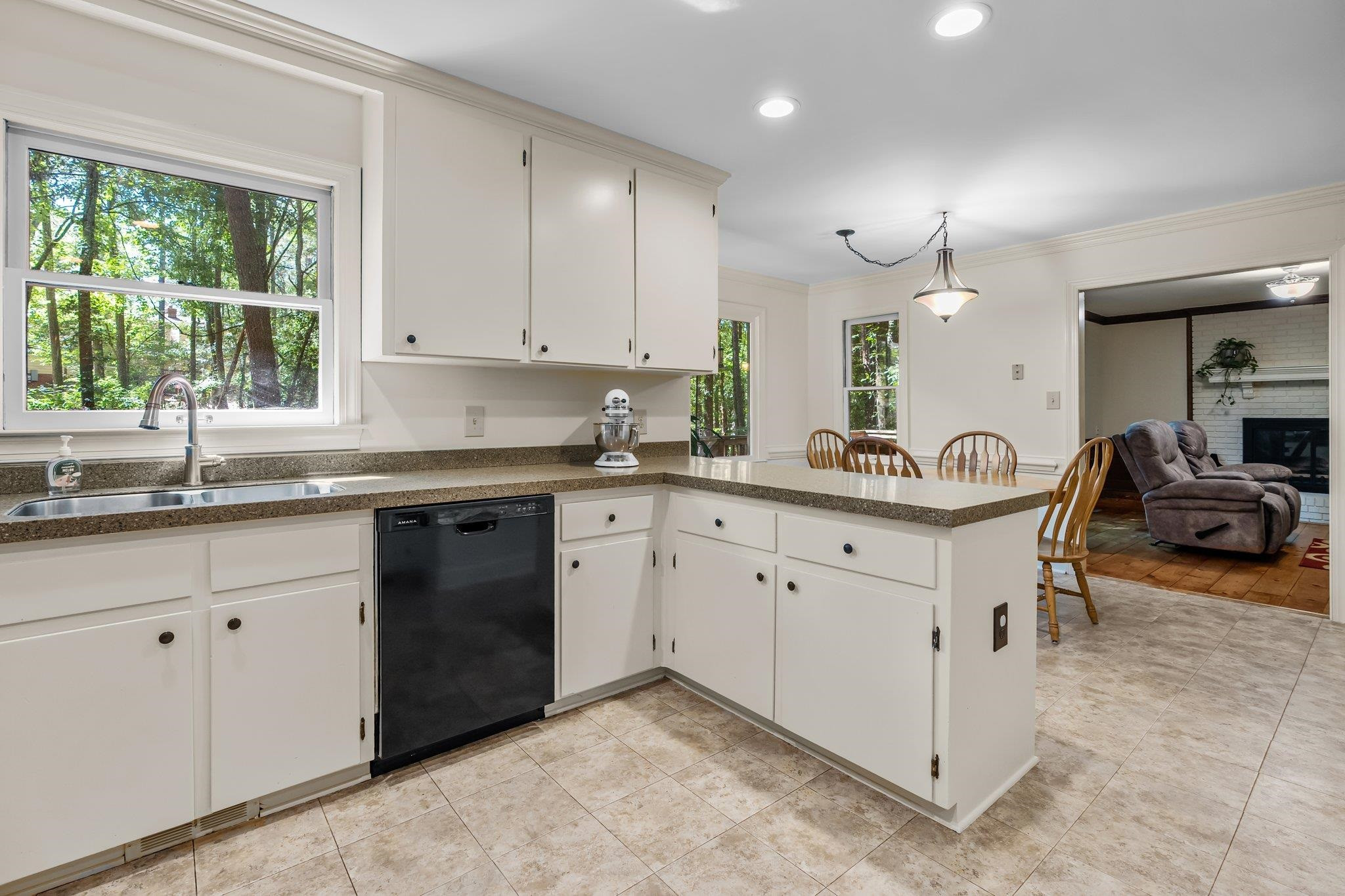 4918 Highgate Drive Durham, NC 27713 - Photo 5 of 44 a kitchen with sink cabinets and window