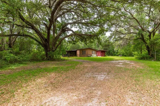 a view of lake with green space