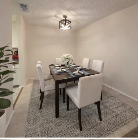 a view of a dining room with furniture