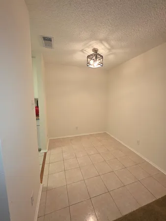 an empty room with a empty space and a sink