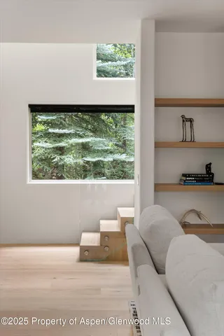 a living room with a couch and a large window