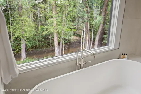 a bathroom with a bathtub and a sink