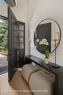 a bedroom with a bed and a potted plant