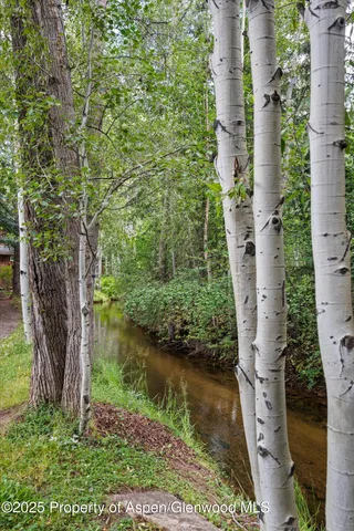 an aerial view of residential house with outdoor space