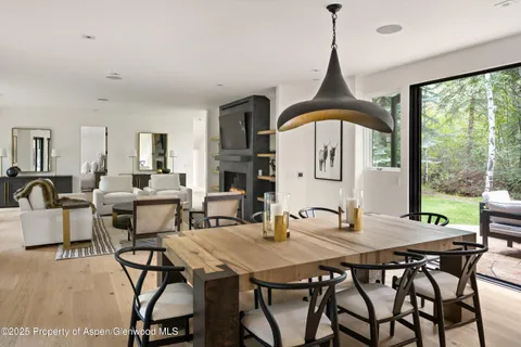 a view of a dining room with furniture window and outside view