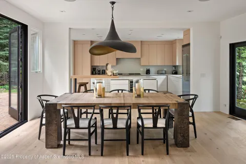 a dining room with furniture and window