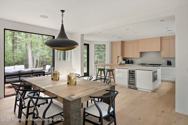 a view of a dining room with furniture window and outside view