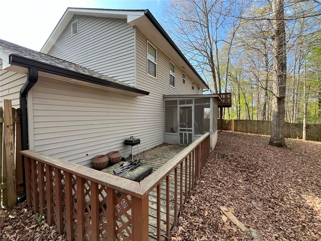 1915 Matthew Way Lithonia, GA 30058 - Photo 2 of 10 a view of house with backyard and trees
