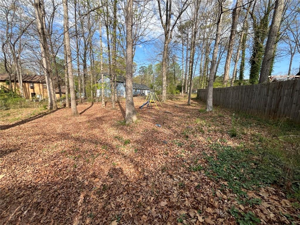 1915 Matthew Way Lithonia, GA 30058 - Photo 9 of 10 a view of backyard of house with green space