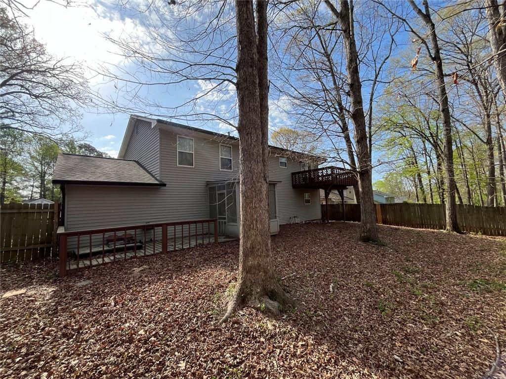 1915 Matthew Way Lithonia, GA 30058 - Photo 10 of 10 a view of a house with a yard and garage