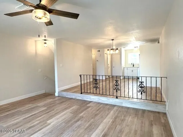 a view of entryway with wooden floor