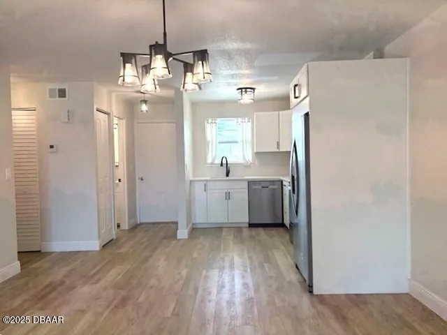 a bathroom with a sink a mirror and a shower