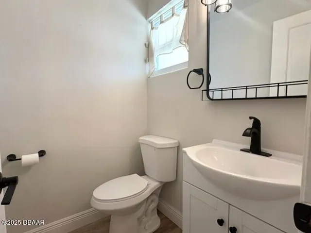 a bathroom with a toilet and a sink
