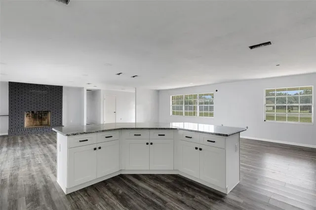a view of cabinets and wooden floor
