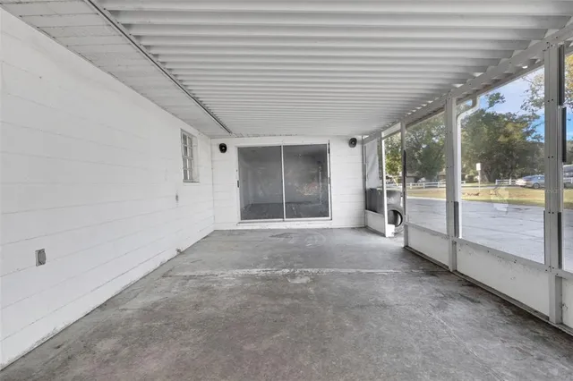 a view of an empty room with a balcony