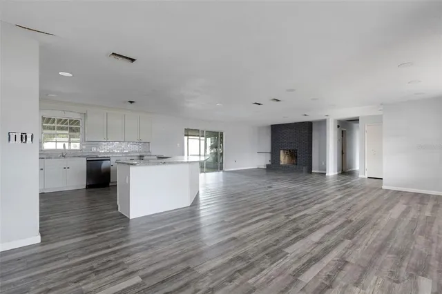 a view of kitchen with wooden floor and window