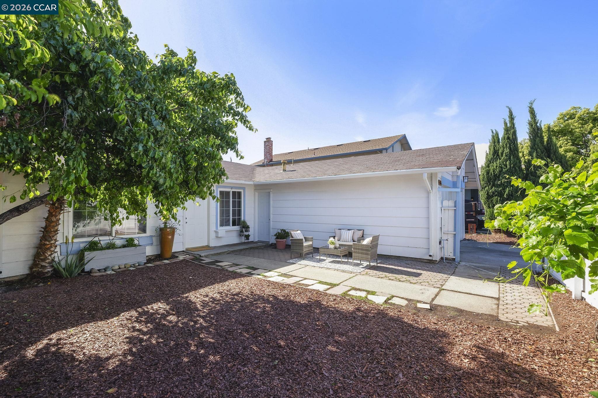 476 Pamela Drive Bay Point, CA 94565 - Photo 18 of 24 a front view of a house with a yard and garage