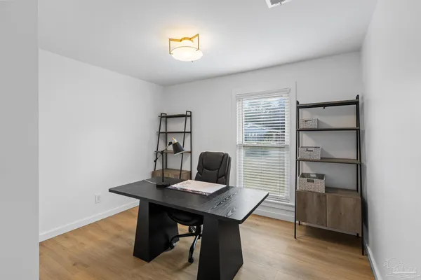 a view of a workspace with furniture