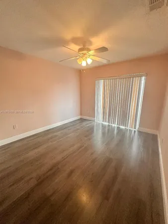 a view of a livingroom with wooden floor
