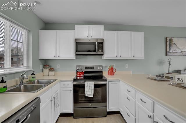1717 Keswick Road Colorado Springs, CO 80906 - Photo 10 of 23 All stainless steel appliances including built-in microwave.