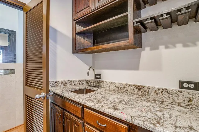 a kitchen with a sink and cabinets