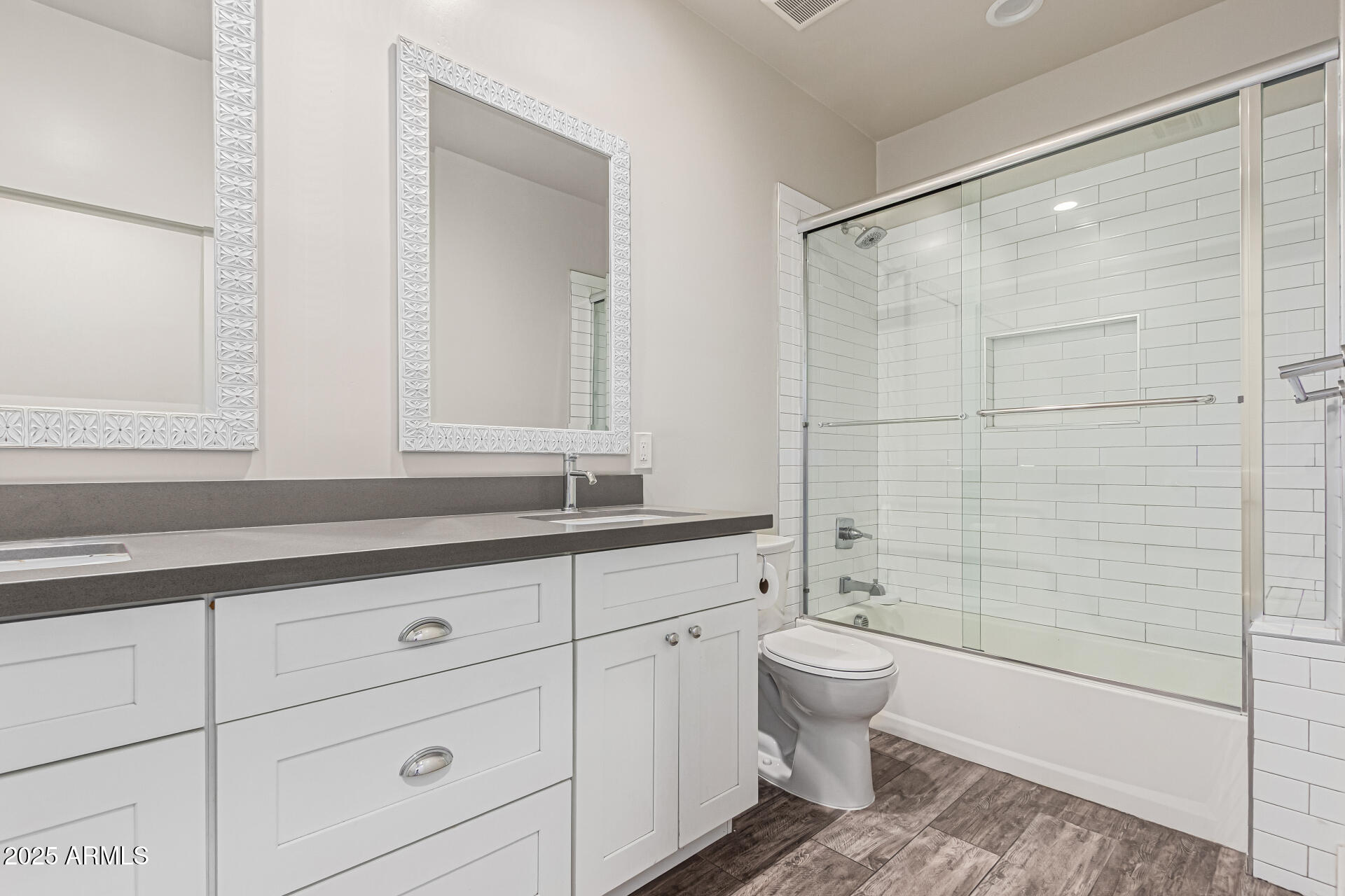 1005 East Weldon Avenue Phoenix, AZ 85014 - Photo 17 of 21 a bathroom with a double vanity sink mirror and toilet