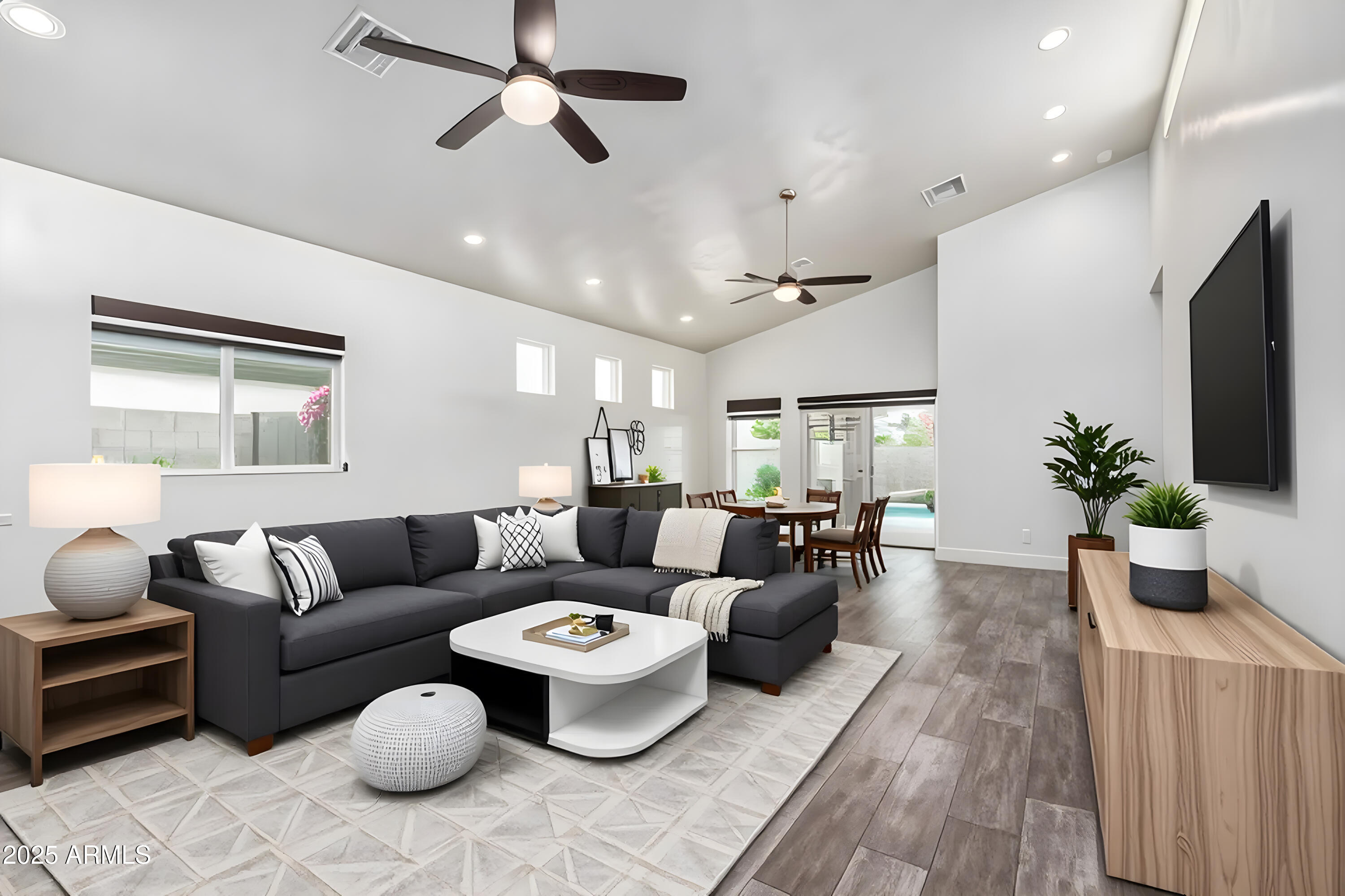 1005 East Weldon Avenue Phoenix, AZ 85014 - Photo 7 of 21 a living room with furniture kitchen view and a potted plant