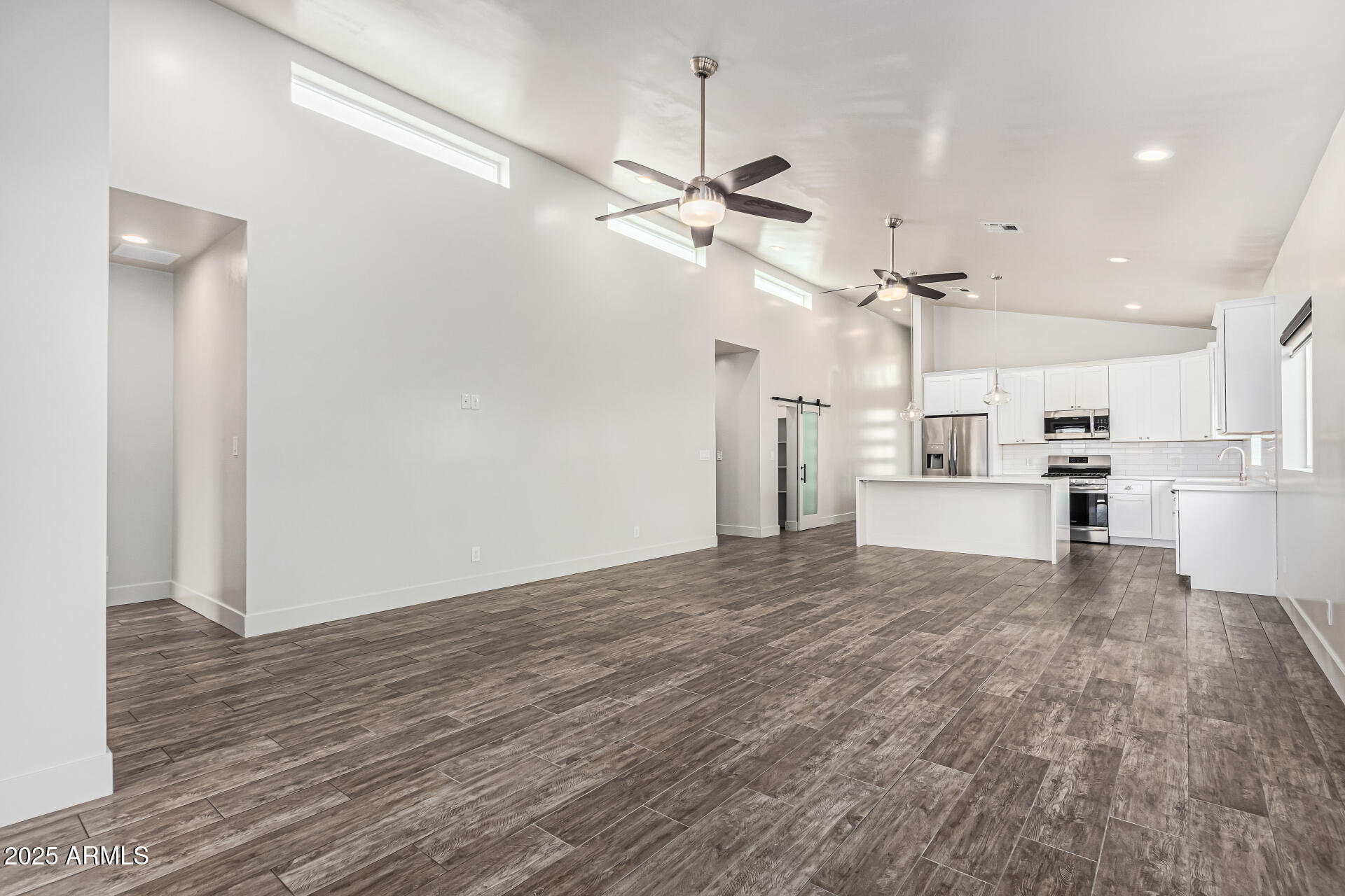 1005 East Weldon Avenue Phoenix, AZ 85014 - Photo 8 of 21 a view of a kitchen with wooden floor and a kitchen