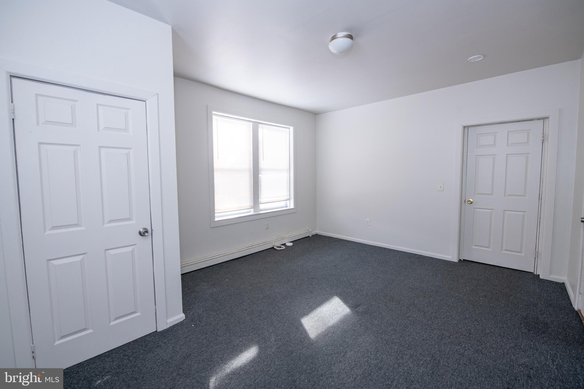 805 Prospect Street Trenton, NJ 08618 - Photo 13 of 31 an empty room with windows