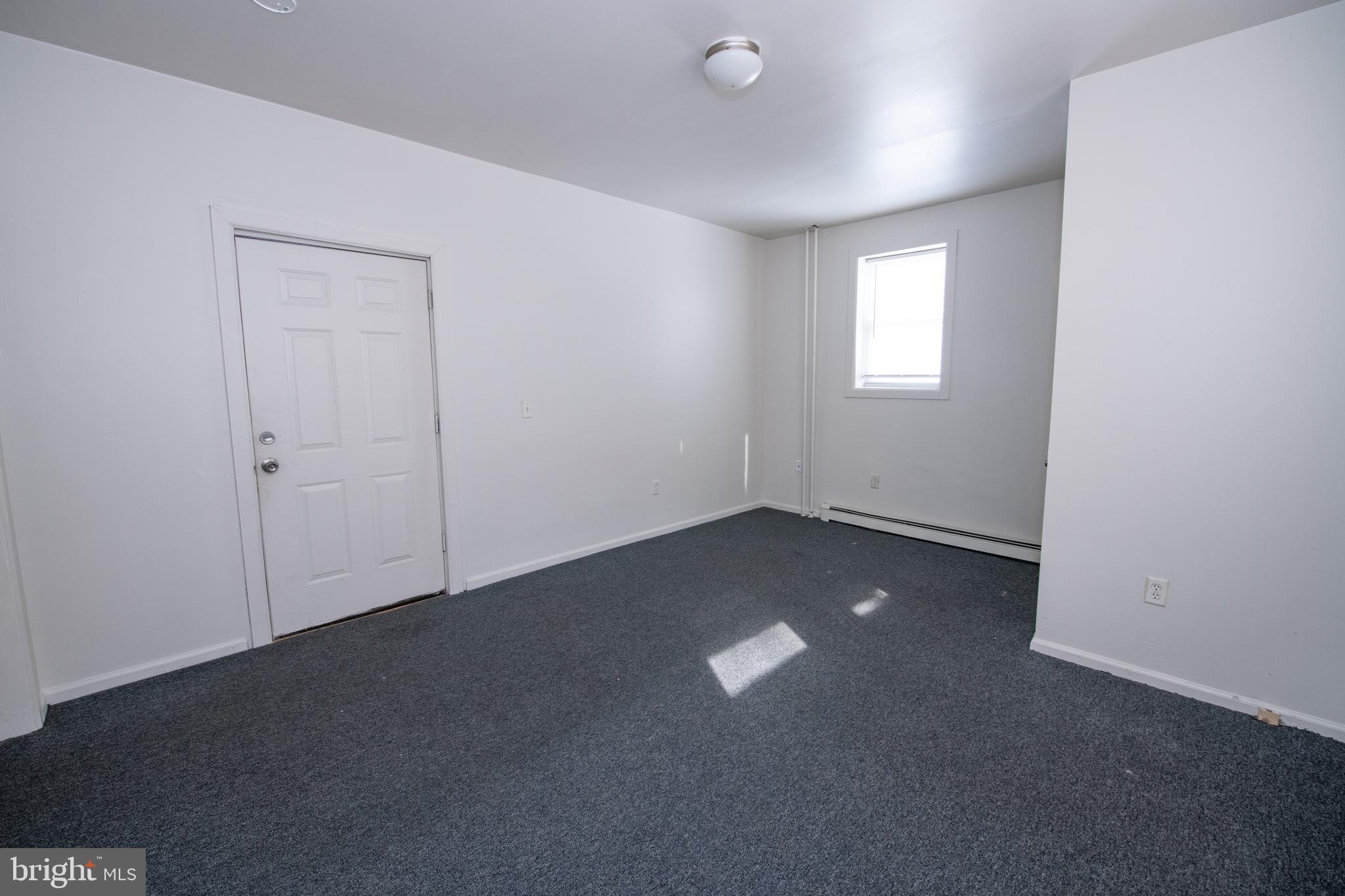 805 Prospect Street Trenton, NJ 08618 - Photo 14 of 31 an empty room with a empty space and windows