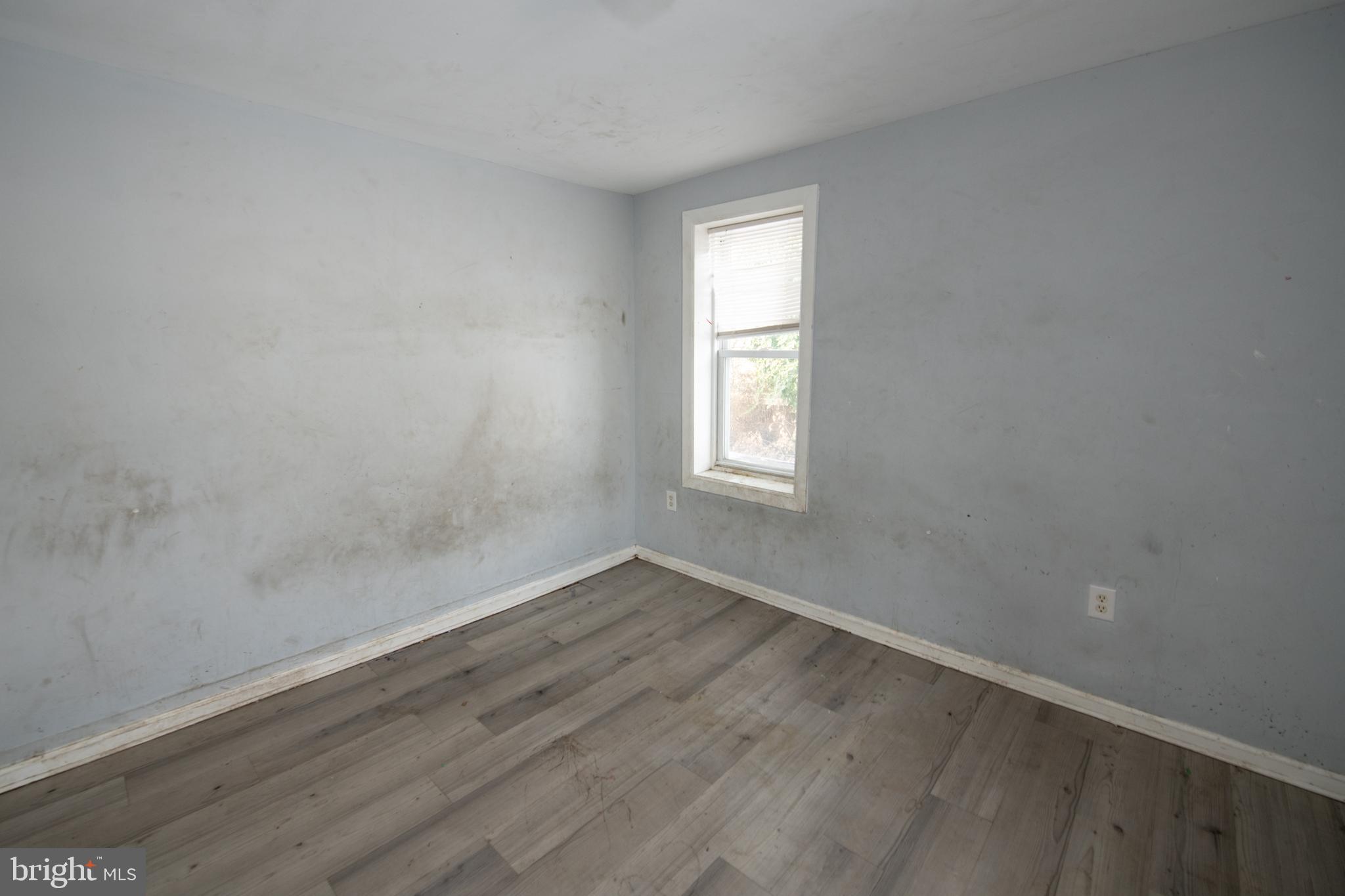 805 Prospect Street Trenton, NJ 08618 - Photo 19 of 31 an empty room with wooden floor and windows