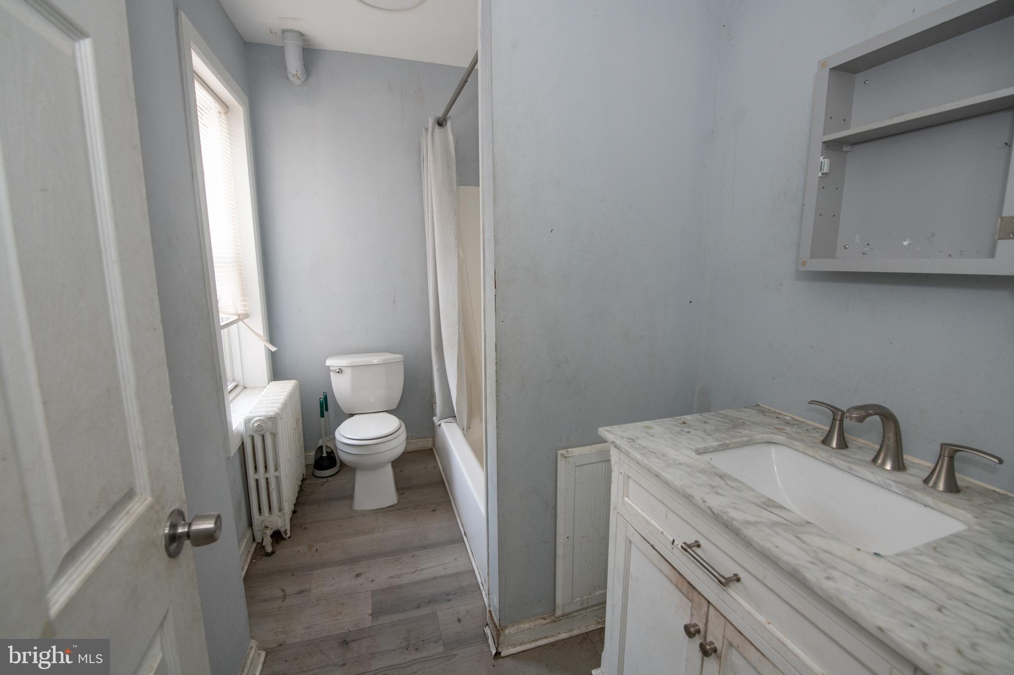 805 Prospect Street Trenton, NJ 08618 - Photo 20 of 31 a view of a bathroom with a sink and a toilet