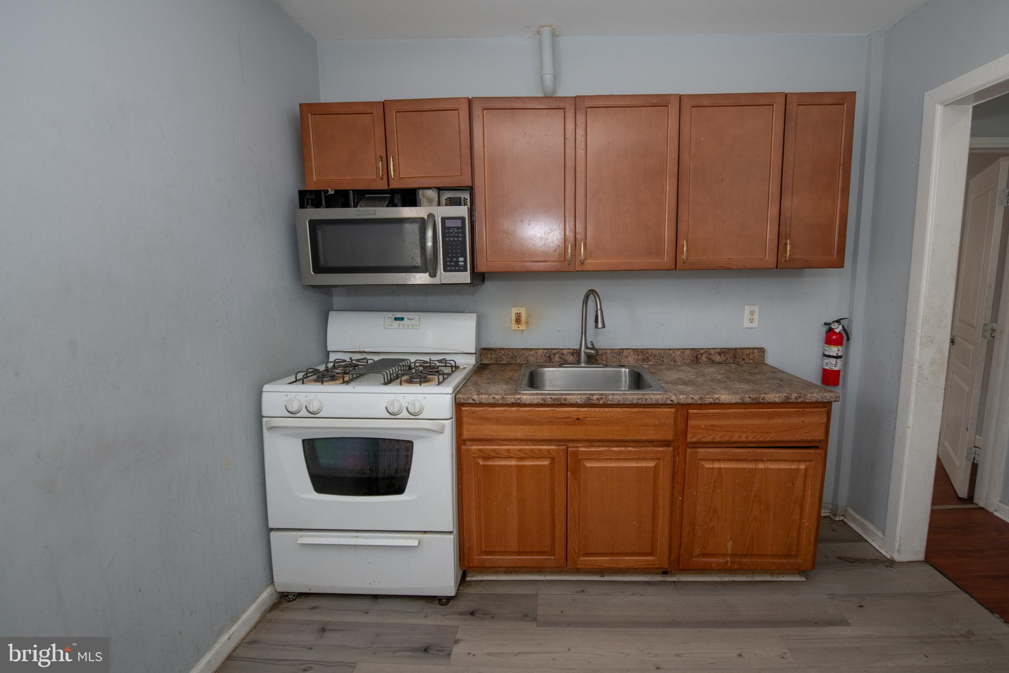 805 Prospect Street Trenton, NJ 08618 - Photo 22 of 31 a kitchen with a sink and a microwave