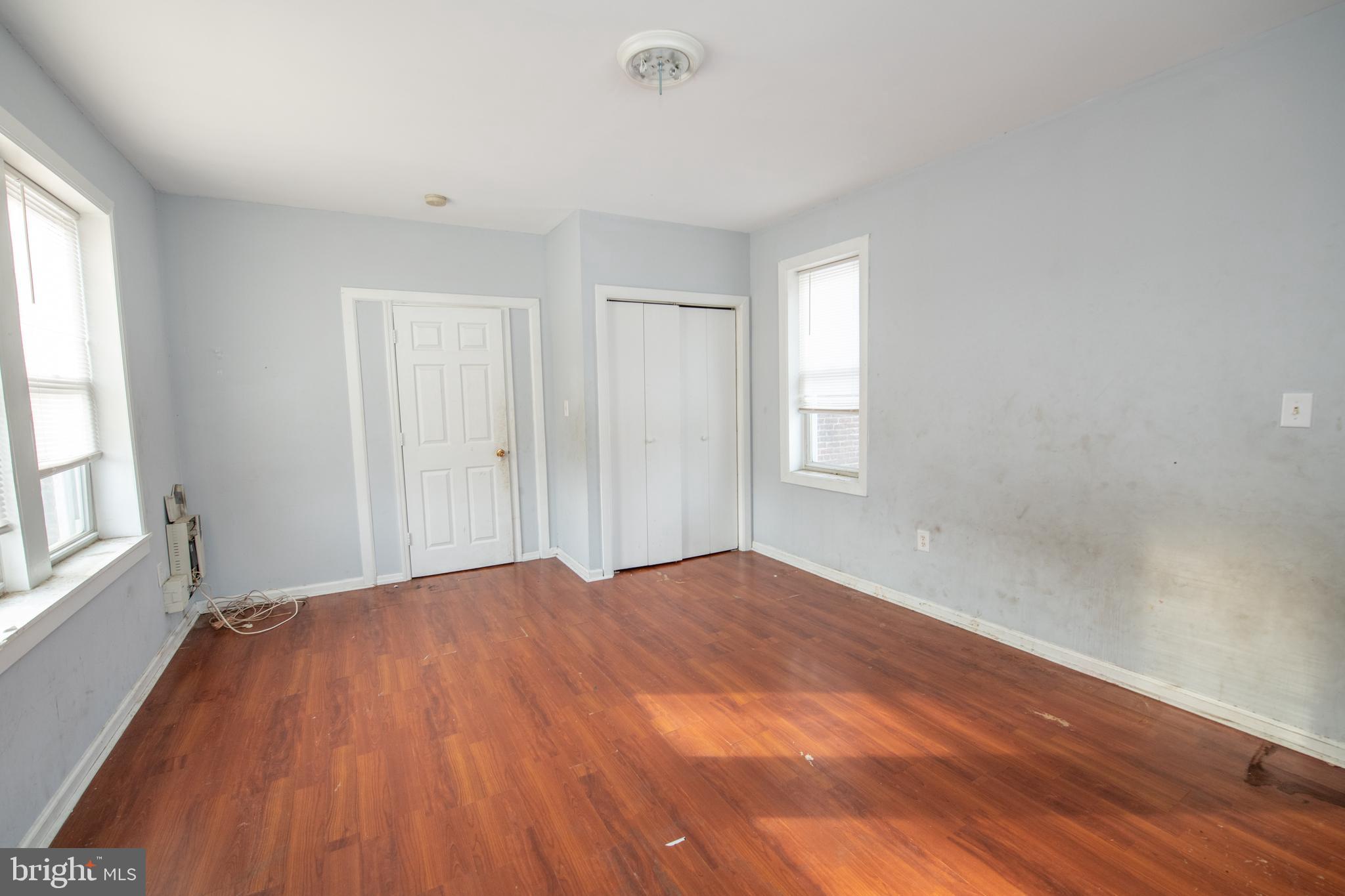805 Prospect Street Trenton, NJ 08618 - Photo 23 of 31 wooden floor in an empty room with a window