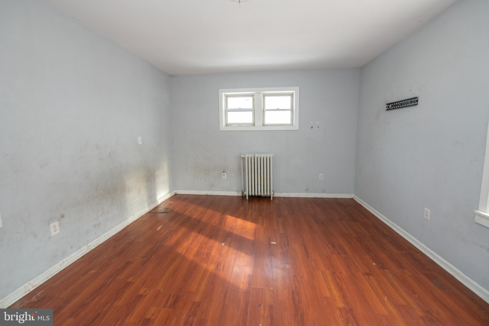 805 Prospect Street Trenton, NJ 08618 - Photo 26 of 31 wooden floor in an empty room with a window