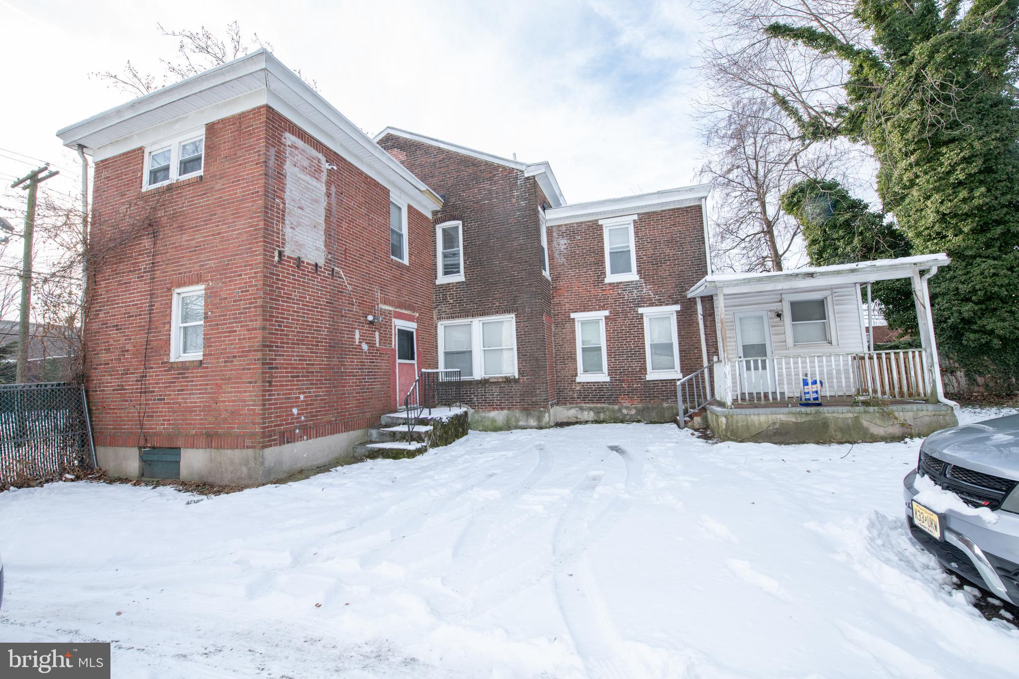 805 Prospect Street Trenton, NJ 08618 - Photo 3 of 31 a view of a house with a snow on the road