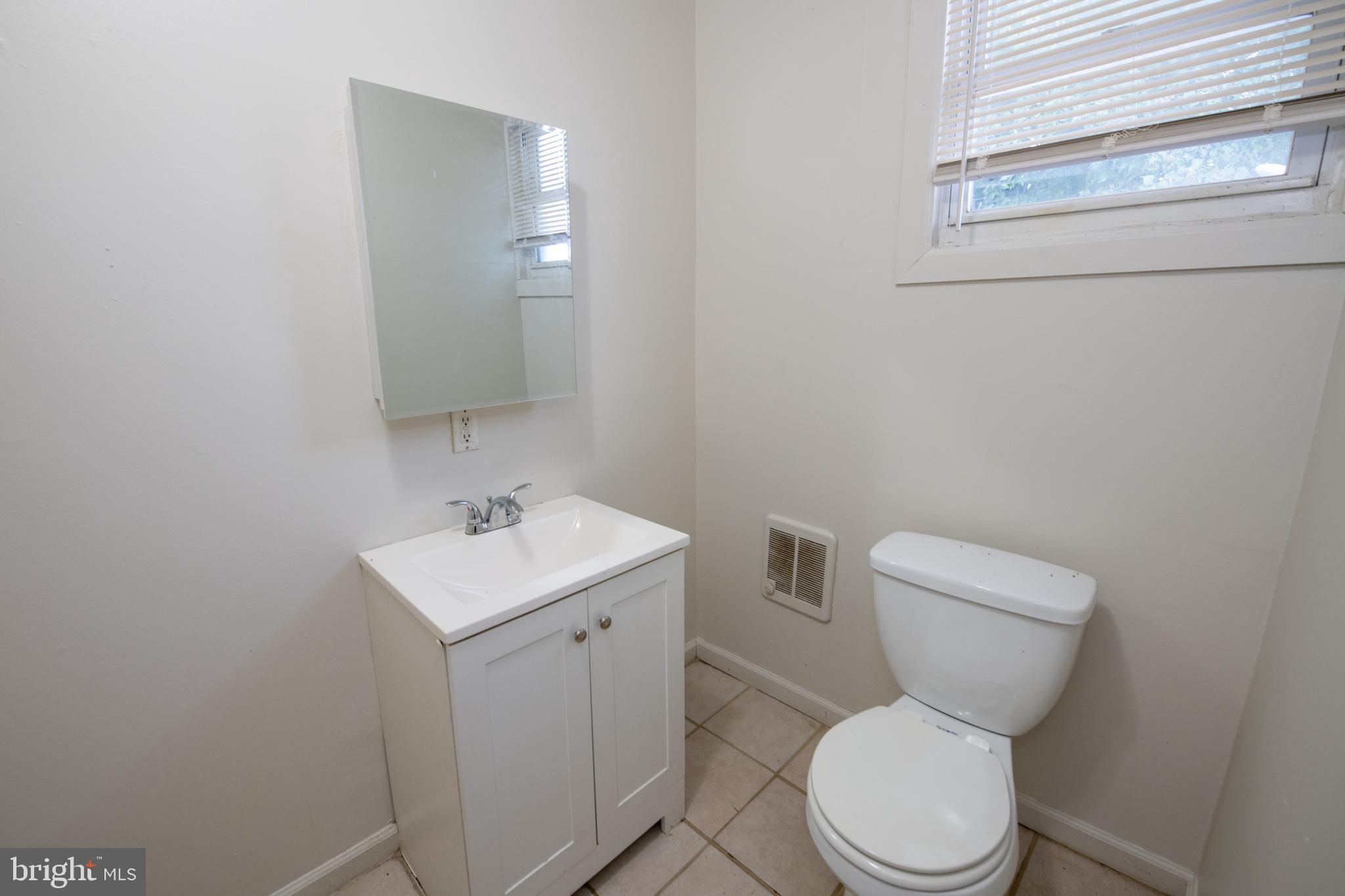 805 Prospect Street Trenton, NJ 08618 - Photo 5 of 31 a white toilet sitting next to a bathroom sink