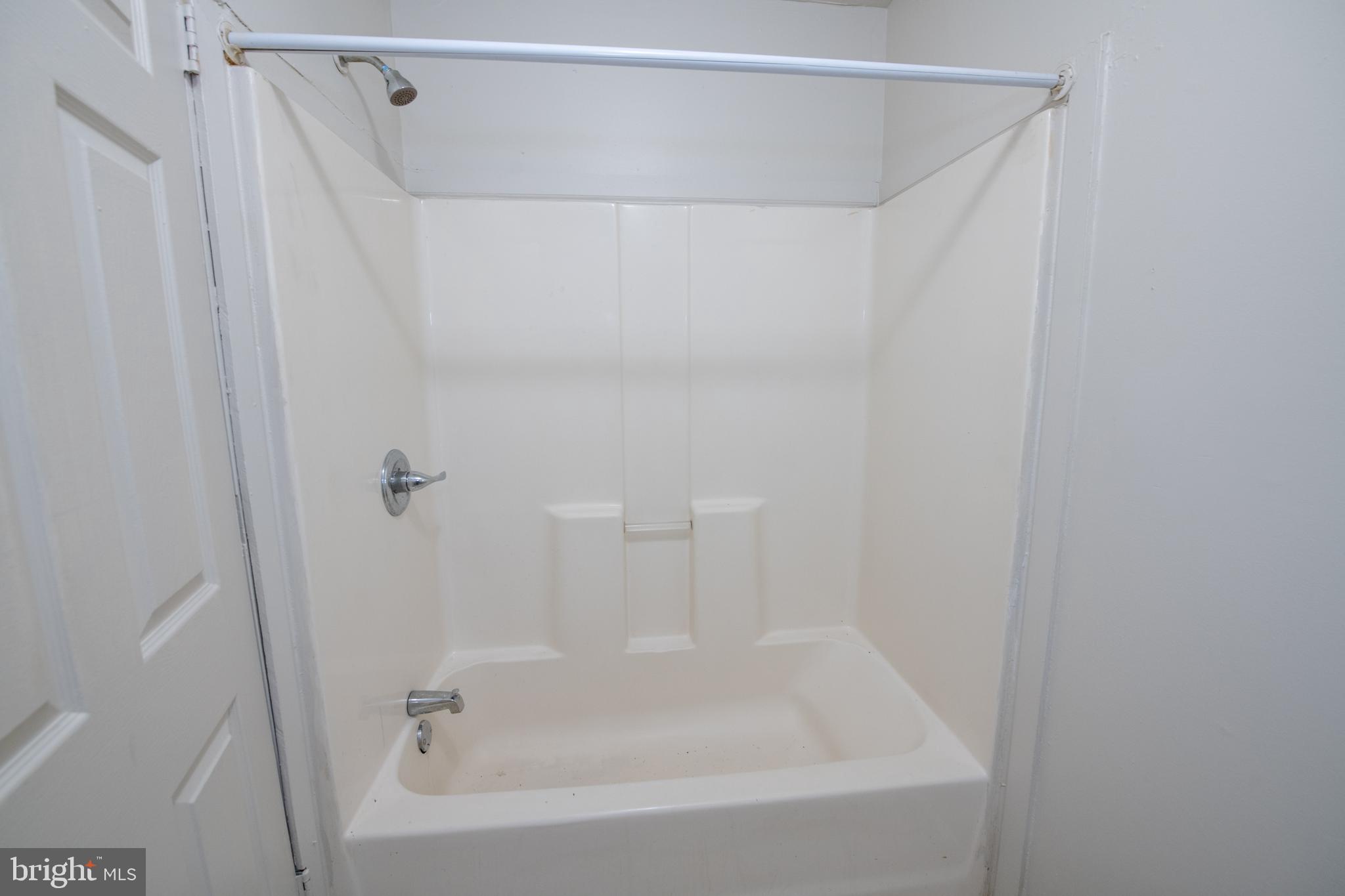 805 Prospect Street Trenton, NJ 08618 - Photo 6 of 31 a close view of a bathtub in a bathroom