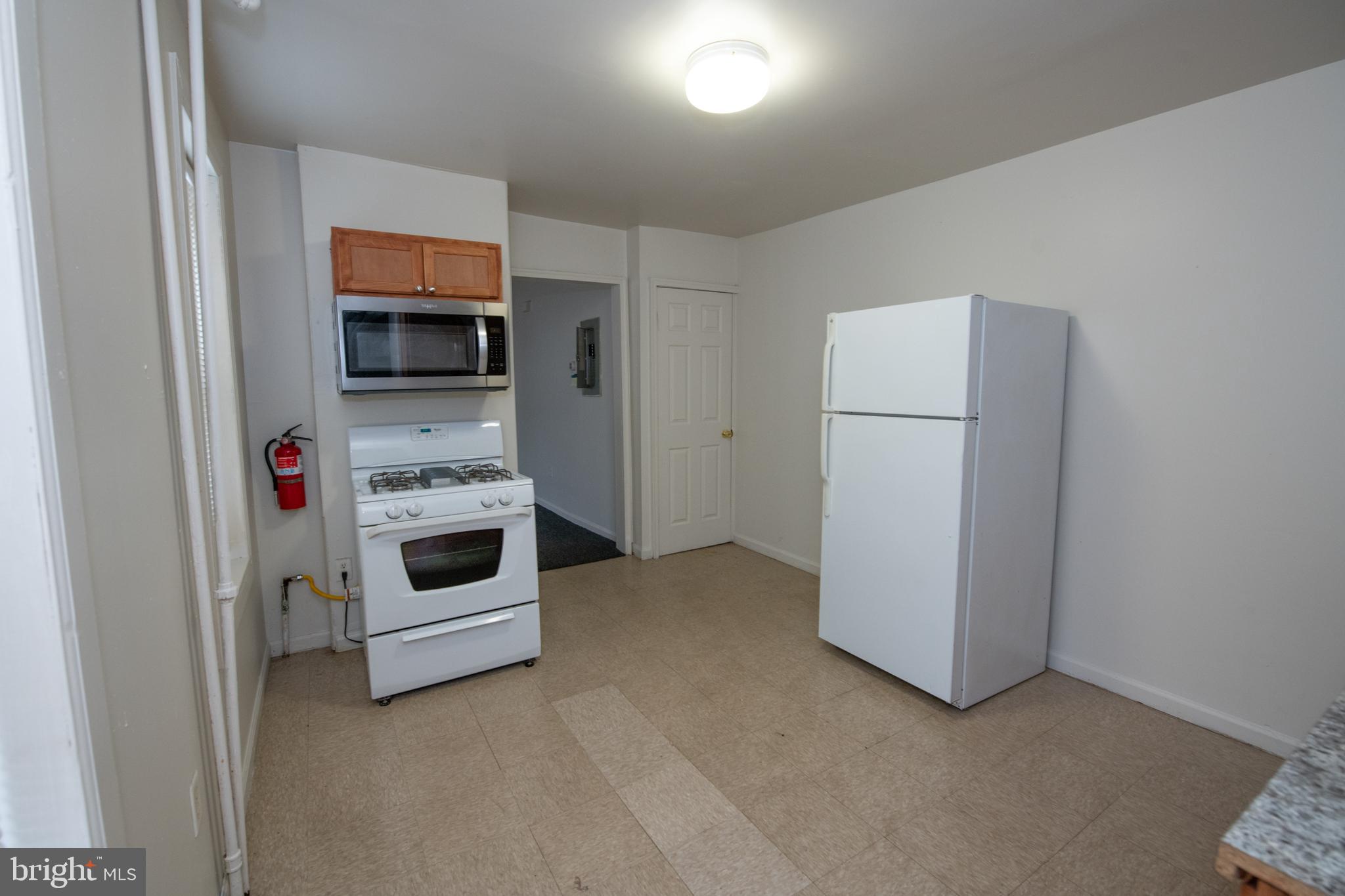 805 Prospect Street Trenton, NJ 08618 - Photo 7 of 31 a view of kitchen and utility room with washer and dryer