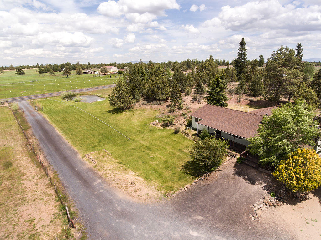 61395 Ward Road Bend, OR 97702 - Photo 43 of 56 a view of a lake with a building in the background