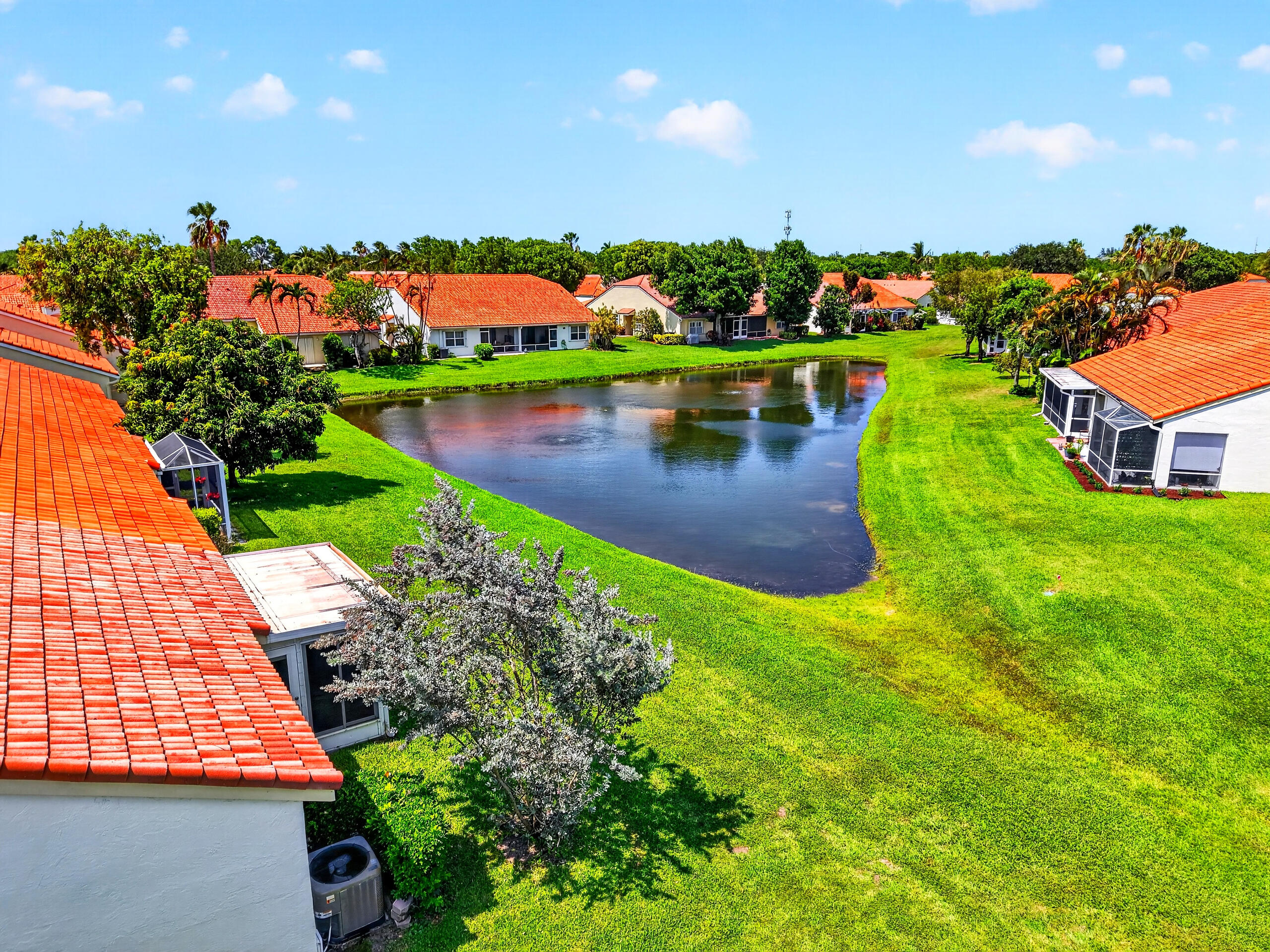 15340 Floral Club Road Delray Beach, FL 33484 - Photo 42 of 42 an aerial view of a house with a garden and lake view