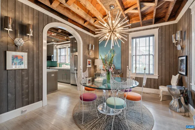 a room with lot of chandelier furniture and windows