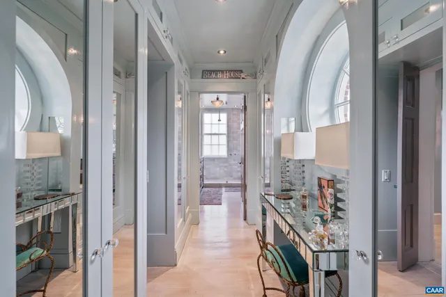 a view of staircase with railing and a rug