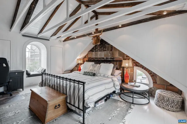 a view of staircase with railing and white walls