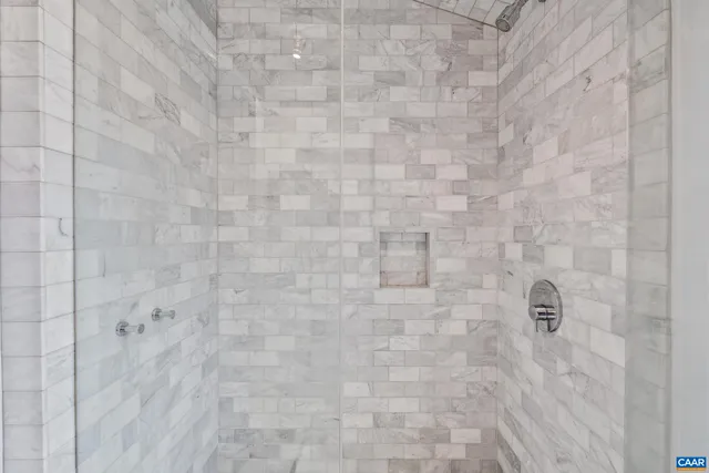 a balcony with table and chairs